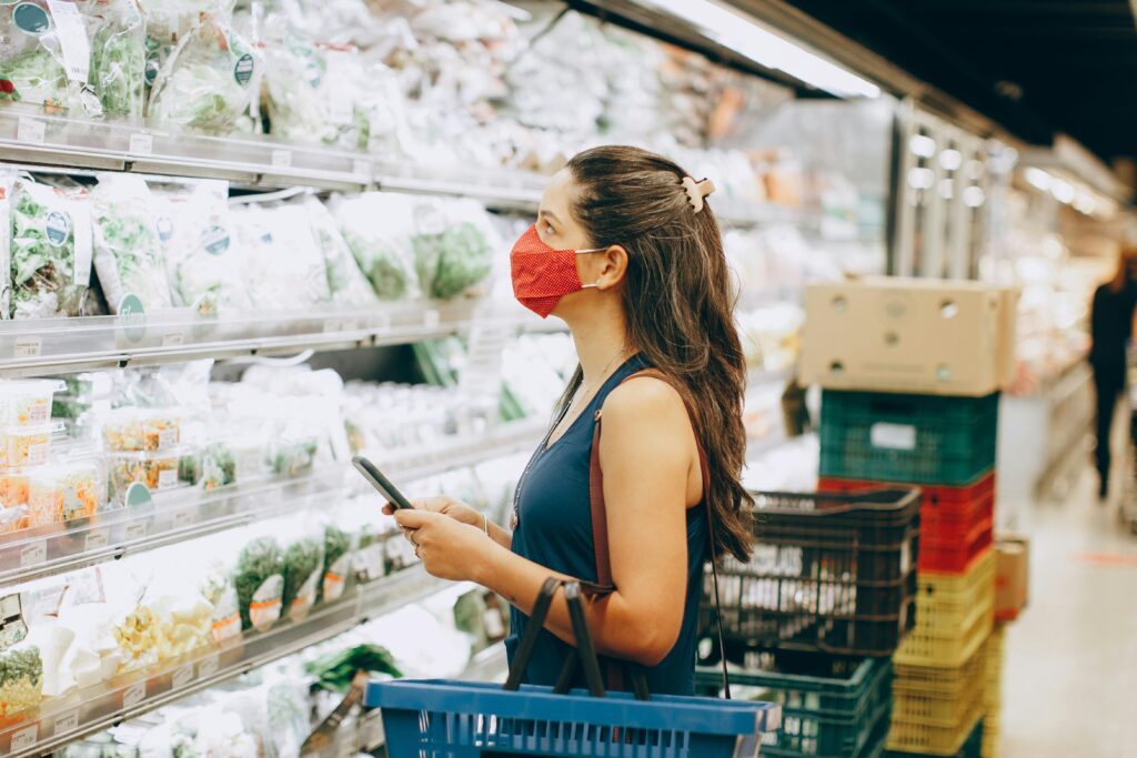 Woman wearing a mask at a grocery store
